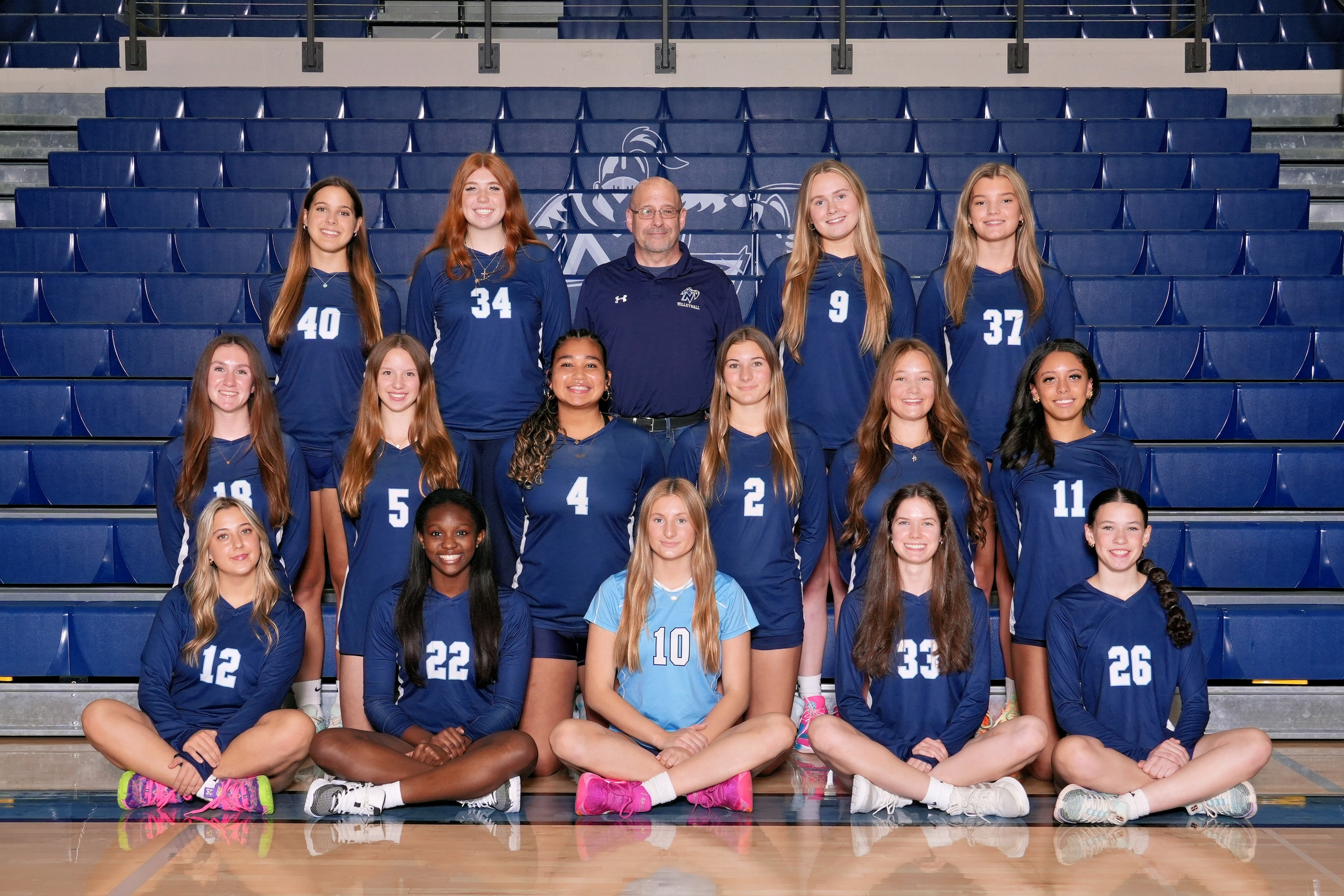 a picture of girls volleyball players smiling