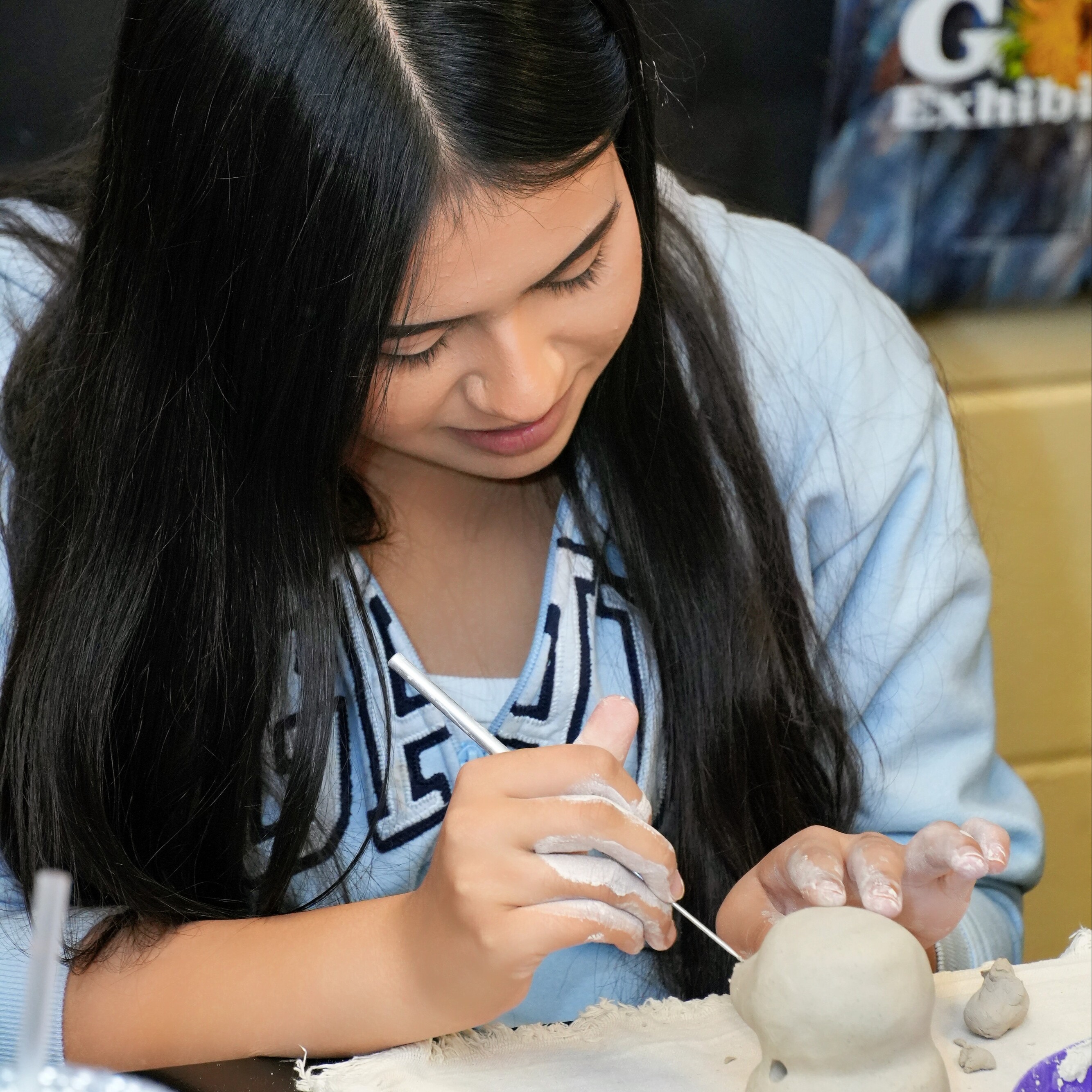 student in art class