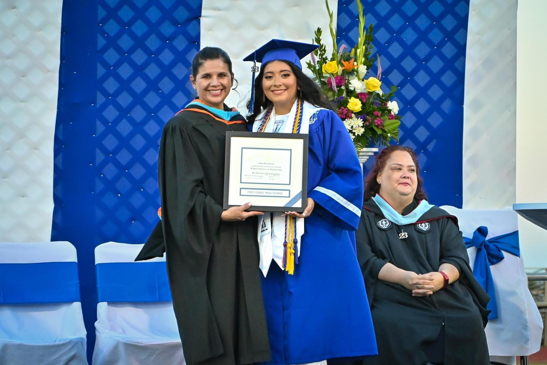 student receiving her diploma