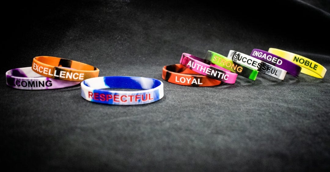 Several colored wristbands printed with values