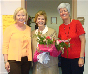 3 school staff smiling