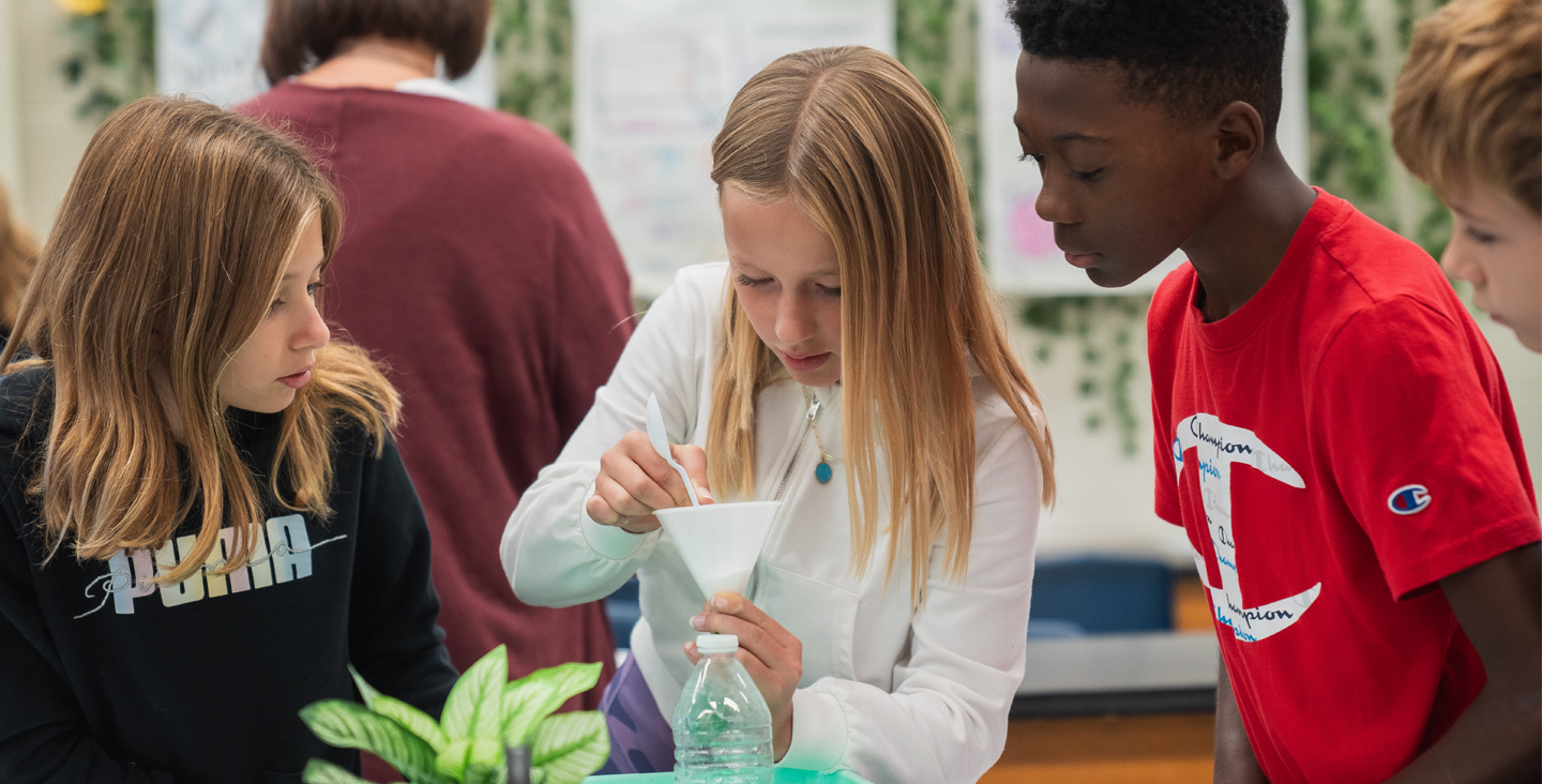 Students learning with a hands on experiment