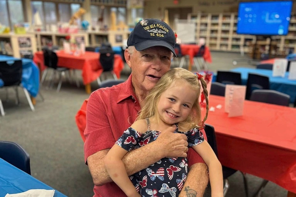 Male and student sitting at a table
