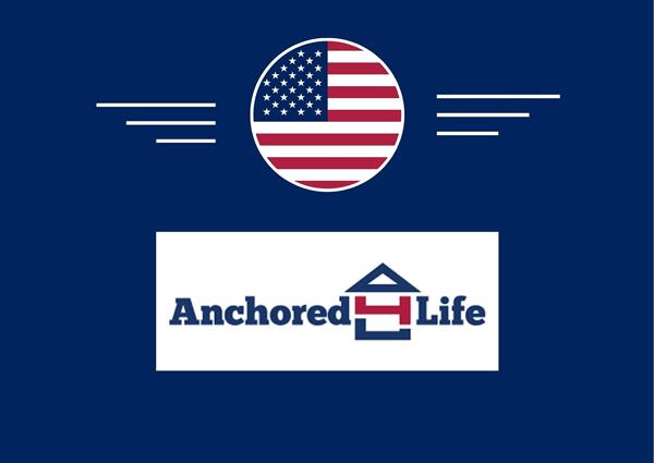 A blue background displays a logo with a white house icon and the text "Anchored Life" in blue, centered above two white wings.