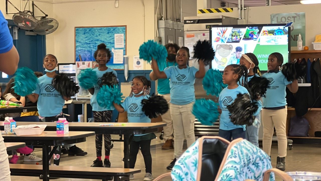 students in class cheering