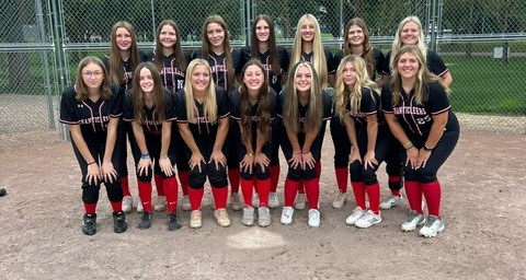 Photo of all the Softball team members together inside their field.