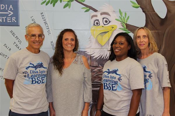 school staff smiling 