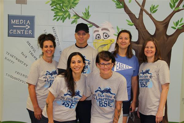 school staff smiling 