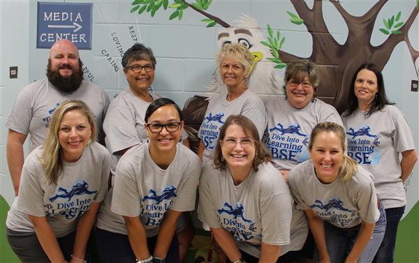 school staff smiling 