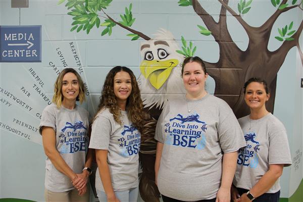 school staff smiling 