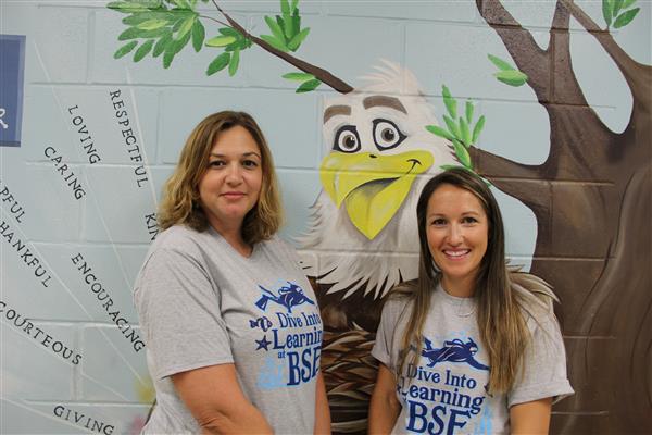 school staff smiling 