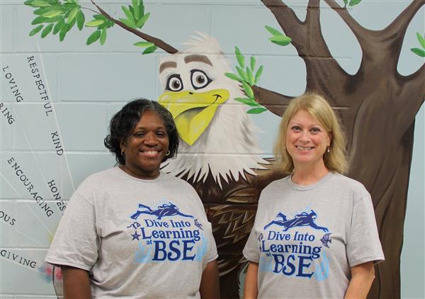 school staff smiling 
