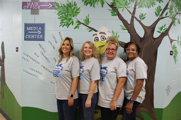 school staff smiling 