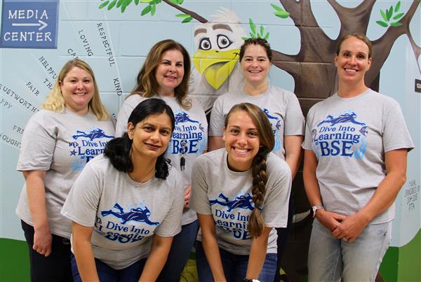 school staff smiling 