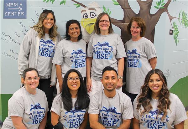school staff smiling 