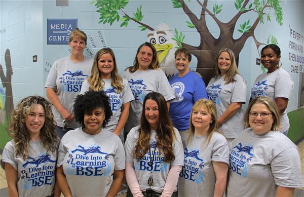 school staff smiling 