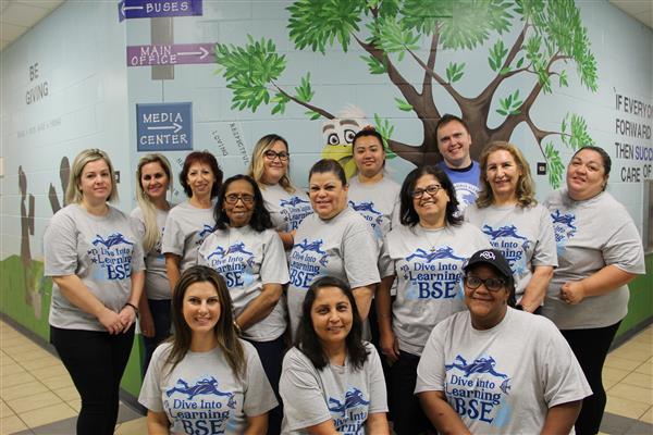 school staff smiling 