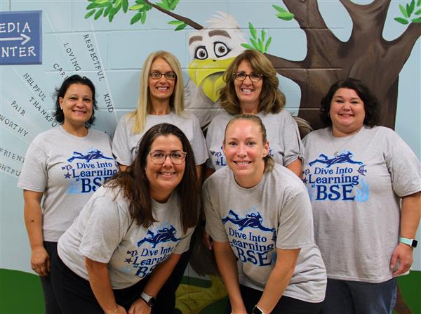school staff smiling 