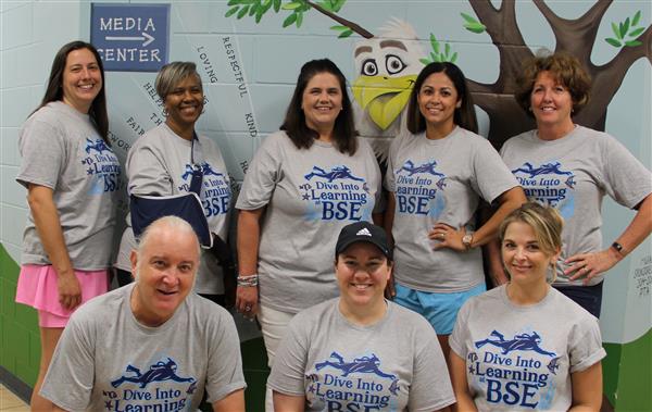 school staff smiling 