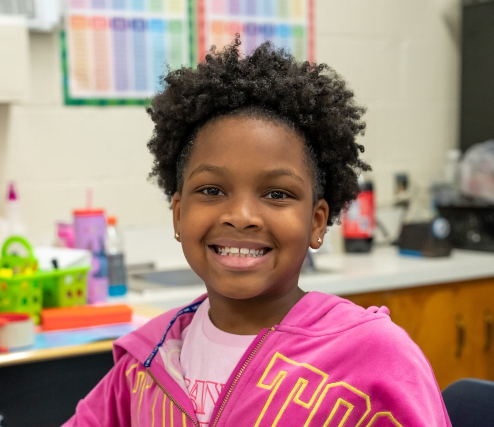 A student smiling at the camera