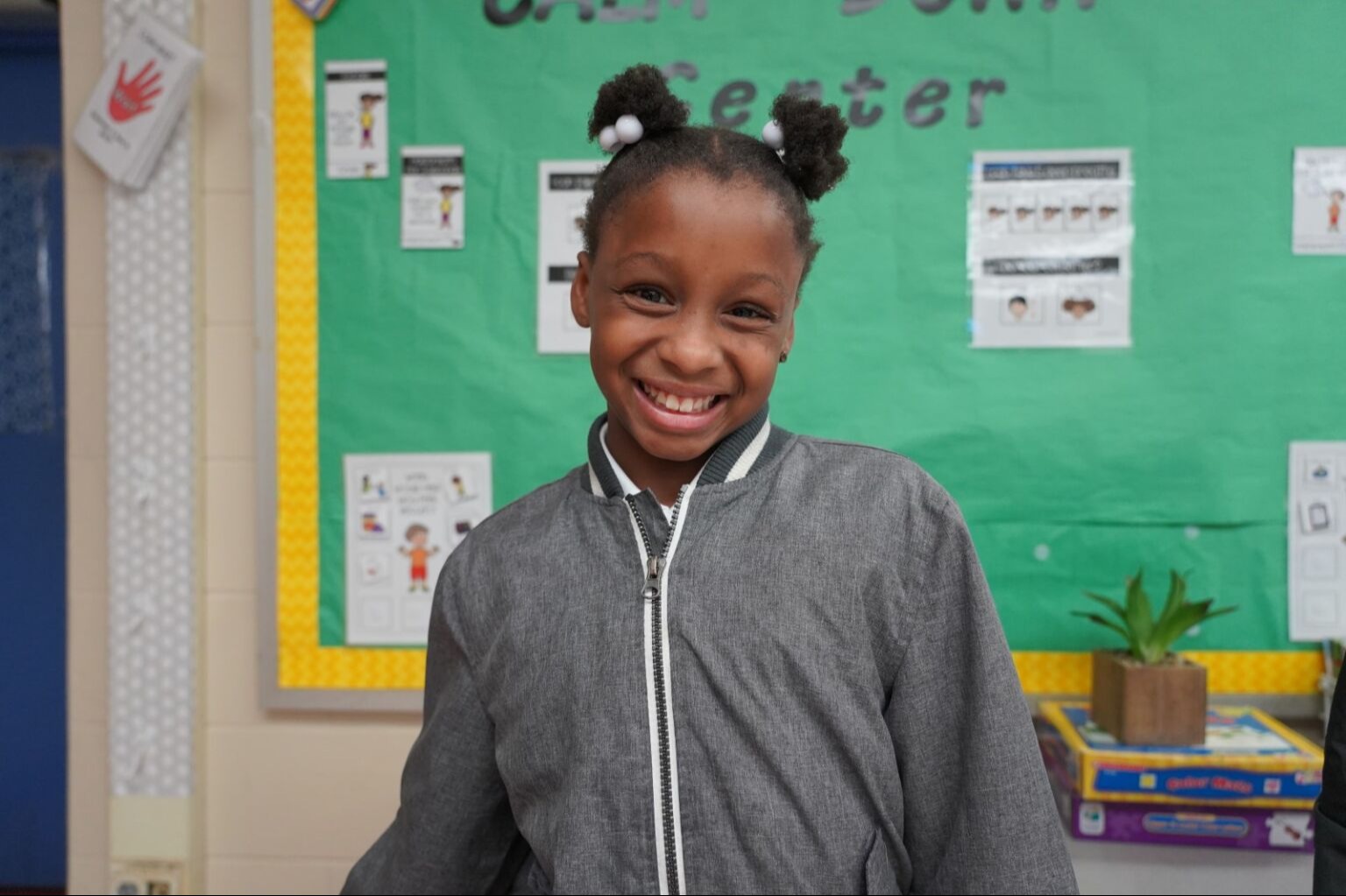 Student smiling at the camera
