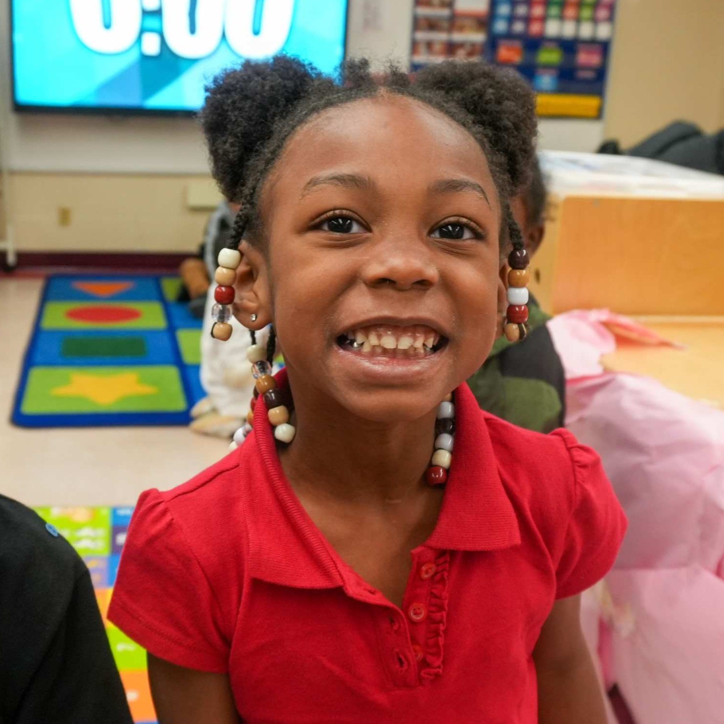 A student smiling really big