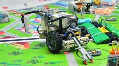 Green robotic with extended hand