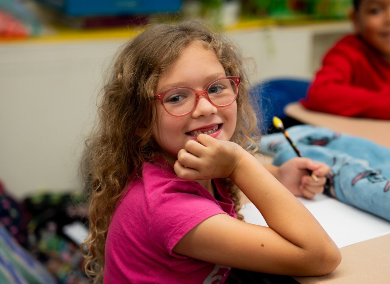 Student smiling at the camera