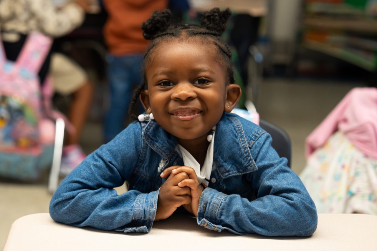 Student smiling at the camera