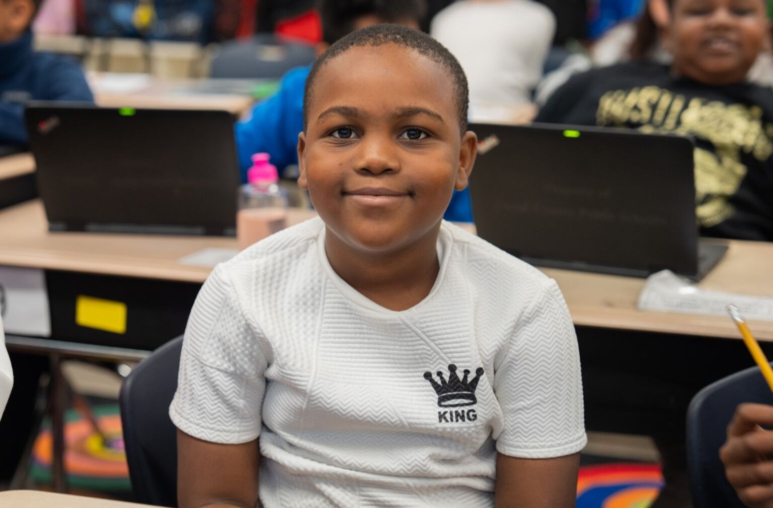 Student smiling at the camera