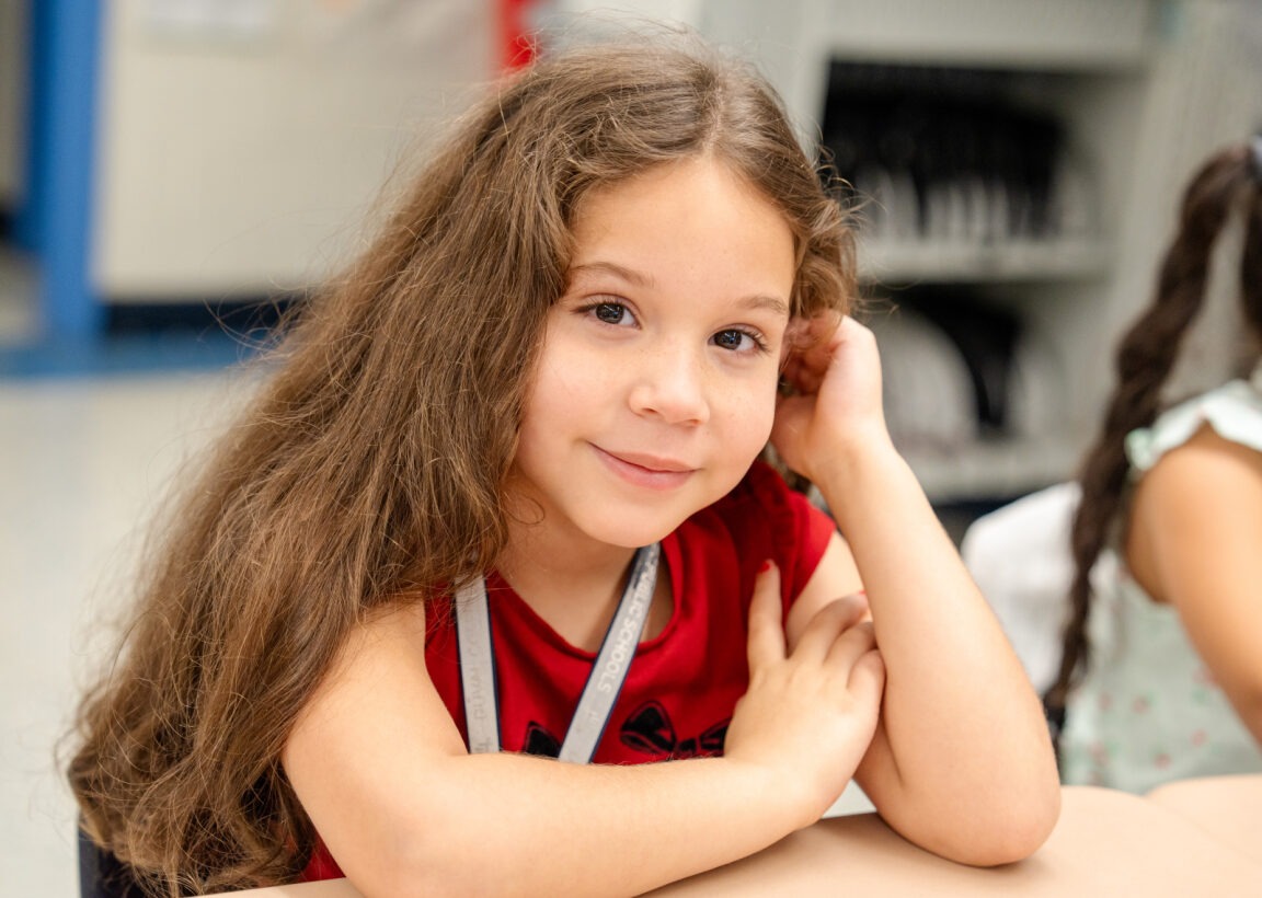 Student smiling at the camera