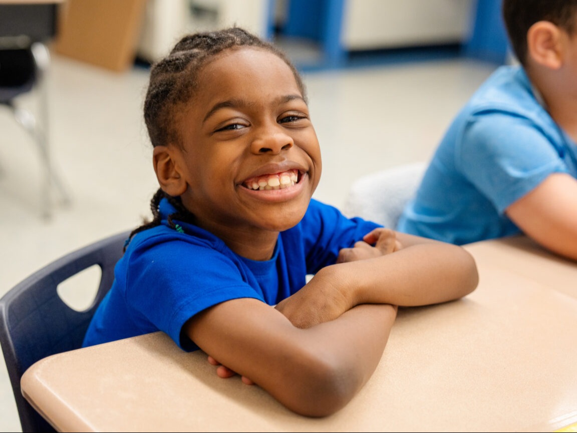 Student smiling at the camera