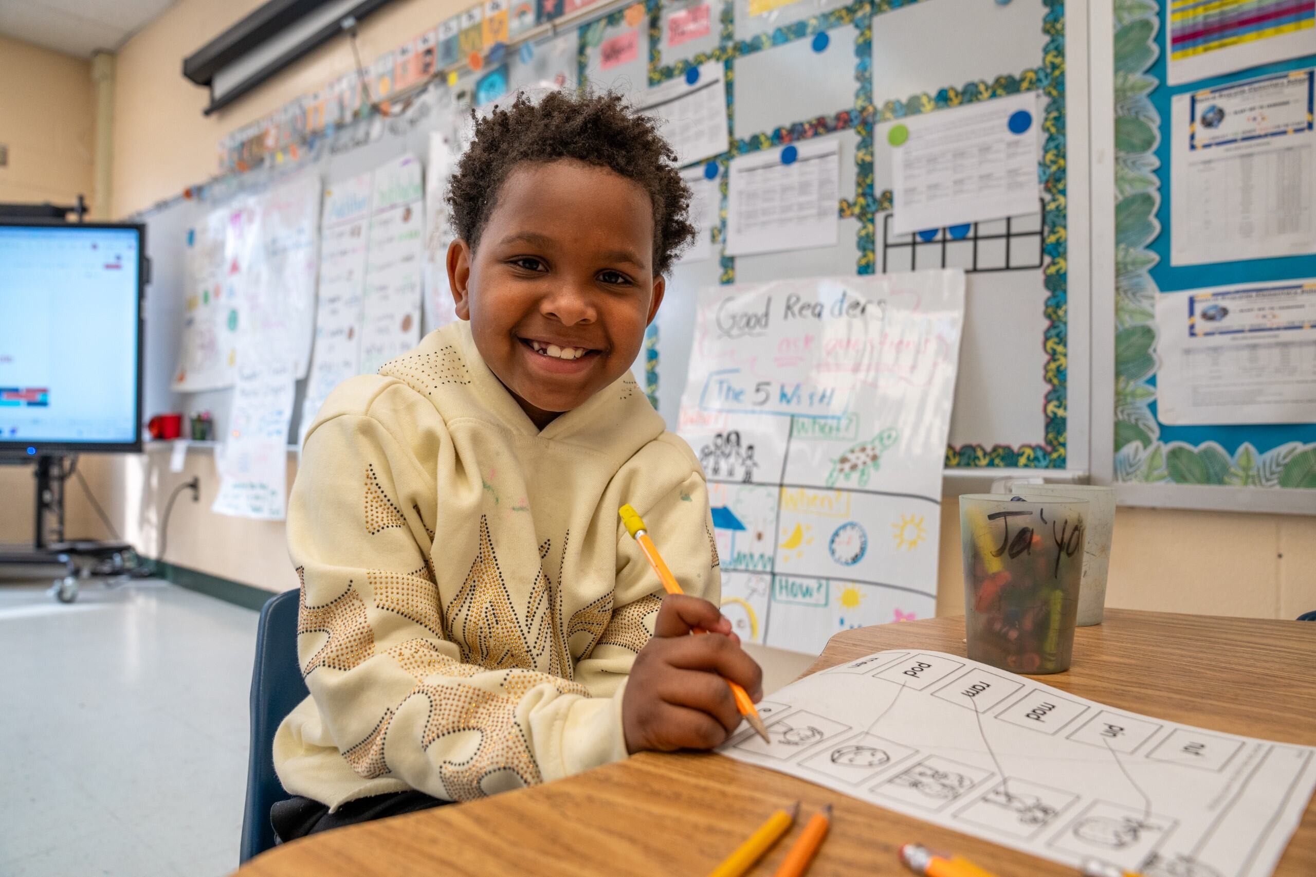 Student smiling at the camera