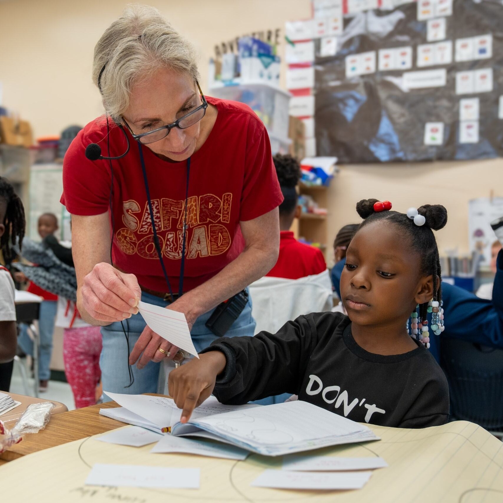 A teacher helping a student