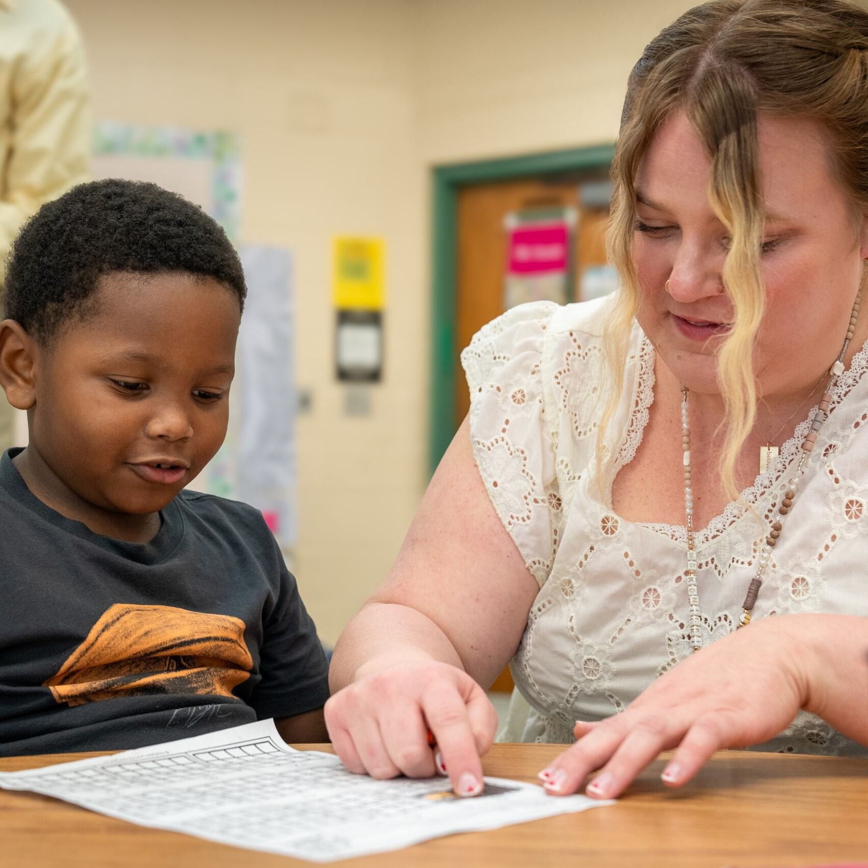 Teacher helping a student
