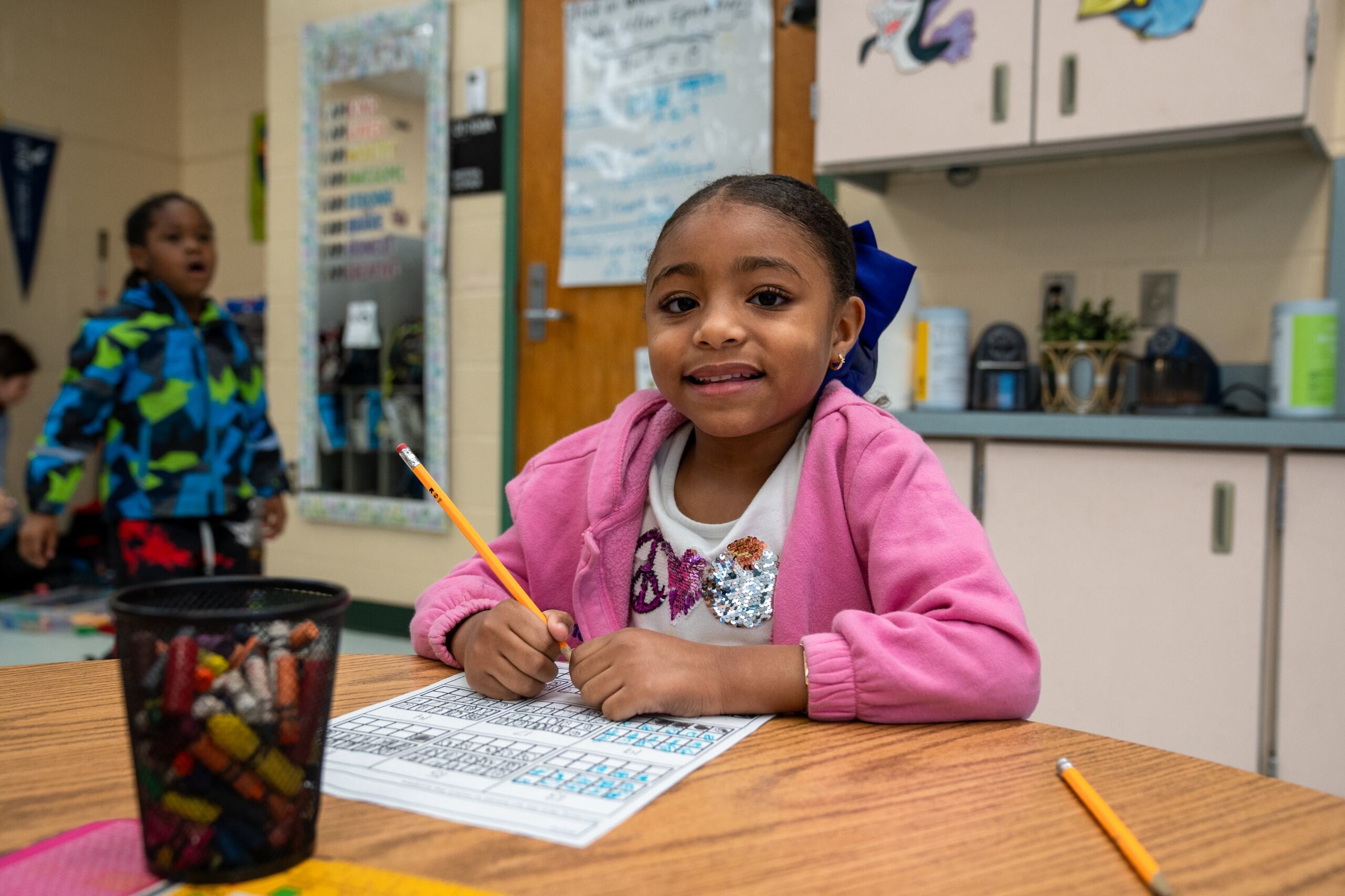 Student smiling at the camera