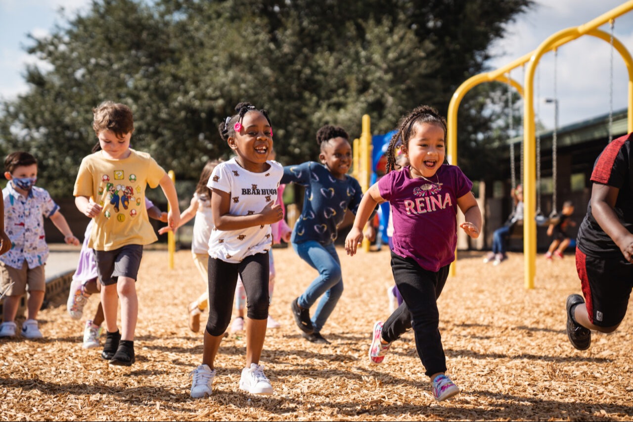 Students running on the playground