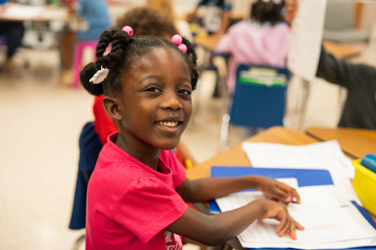 Student smiling at the camera