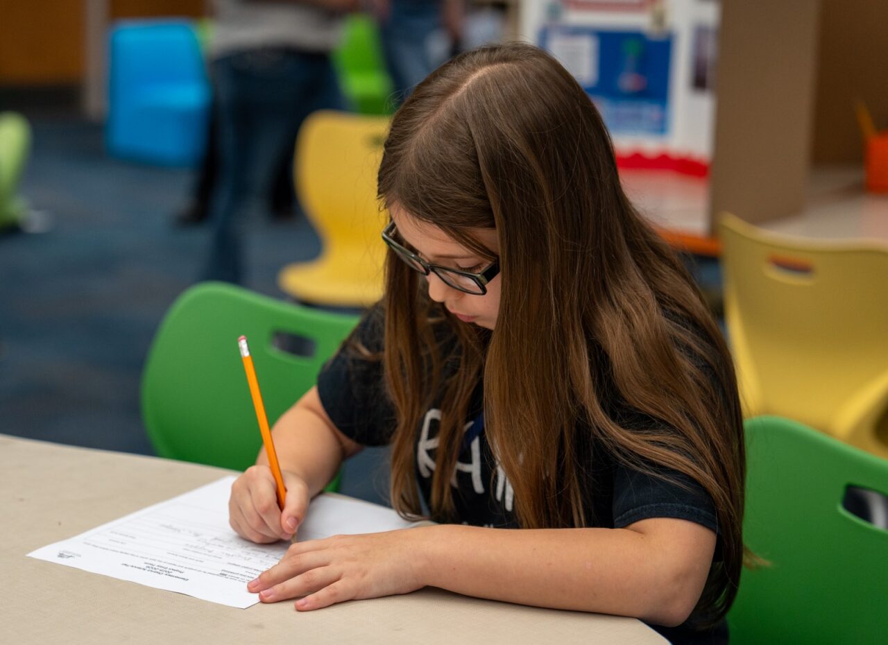 Student writing a letter