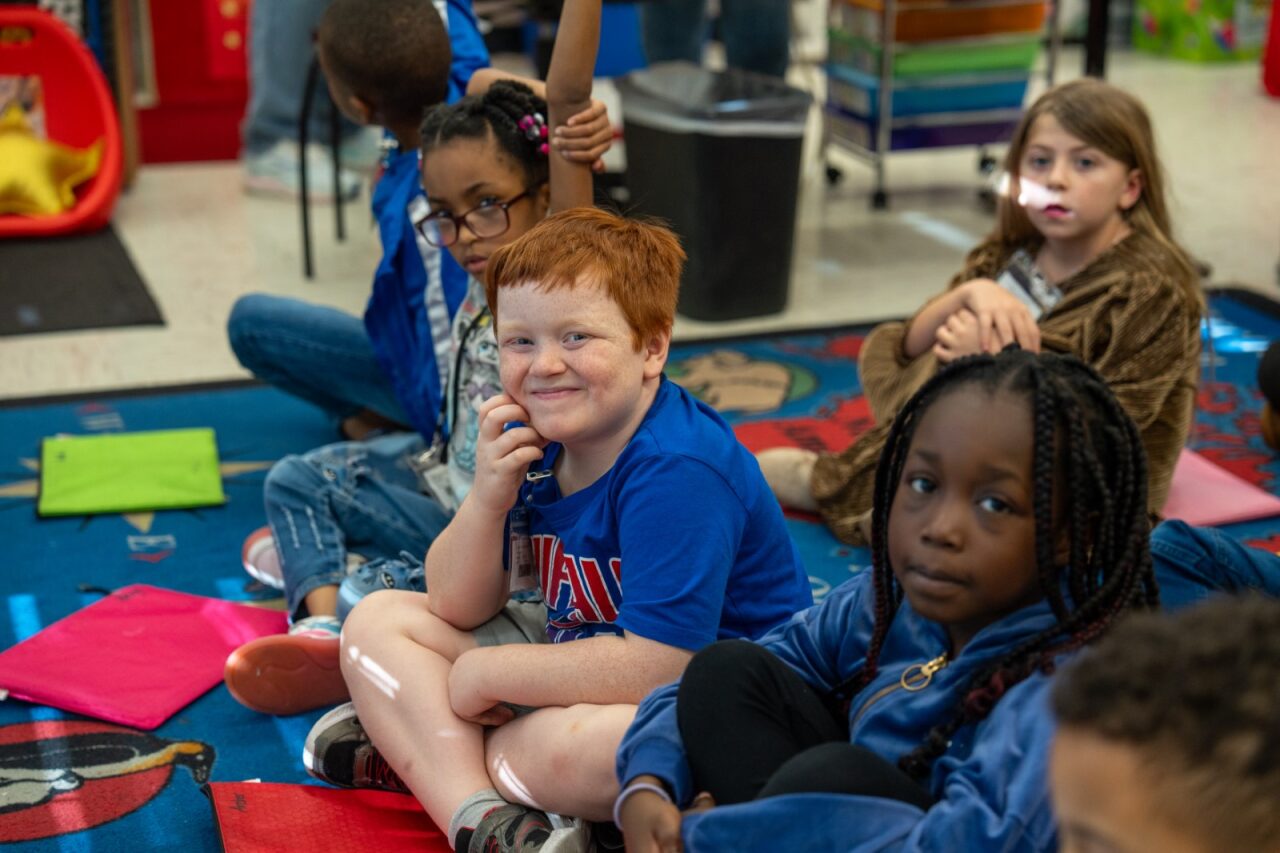 Student smiling at the camera