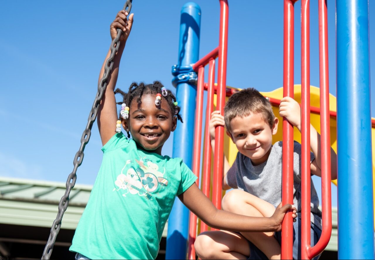 Students smiling on the playground