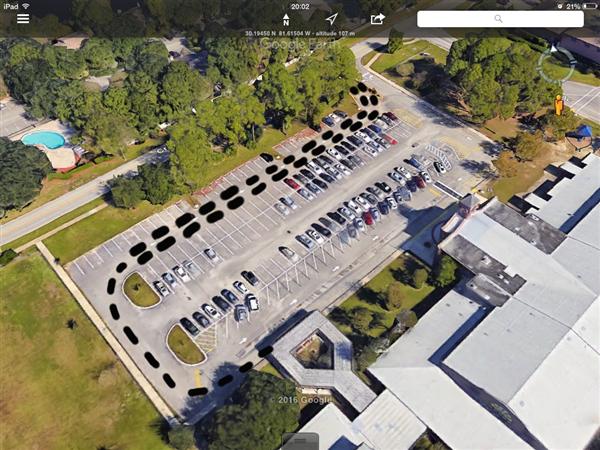 Satellite picture of the car park outside of Crown Point Elementary, marking the drop-off path for car riders