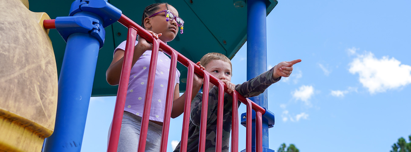 students on playground equipment