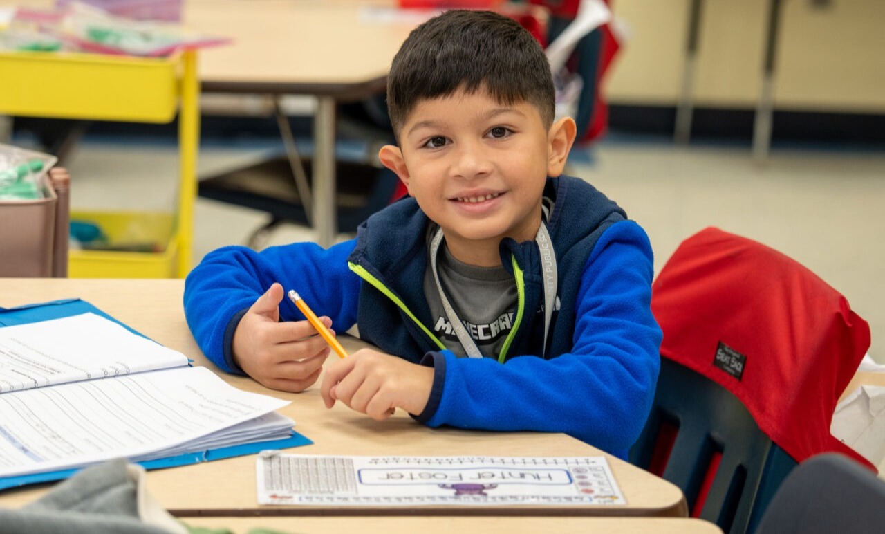 Student smiling at the camera