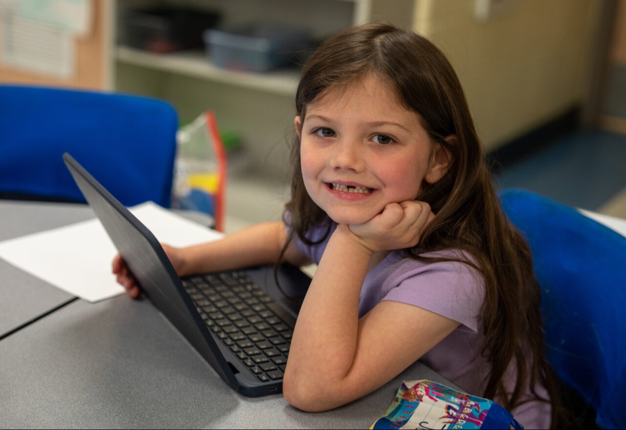 Student smiling at the camera