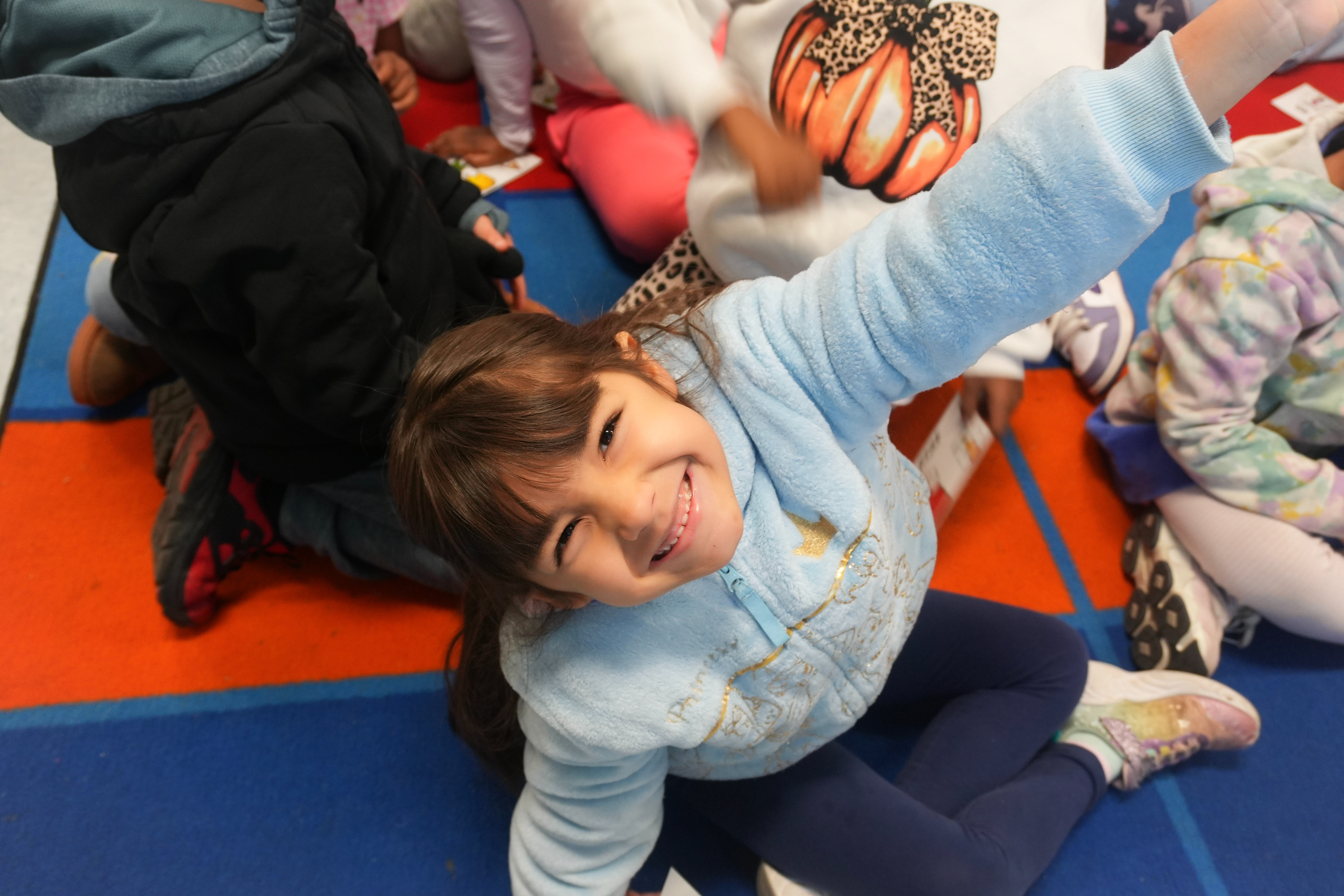 Student smiling on the carpet
