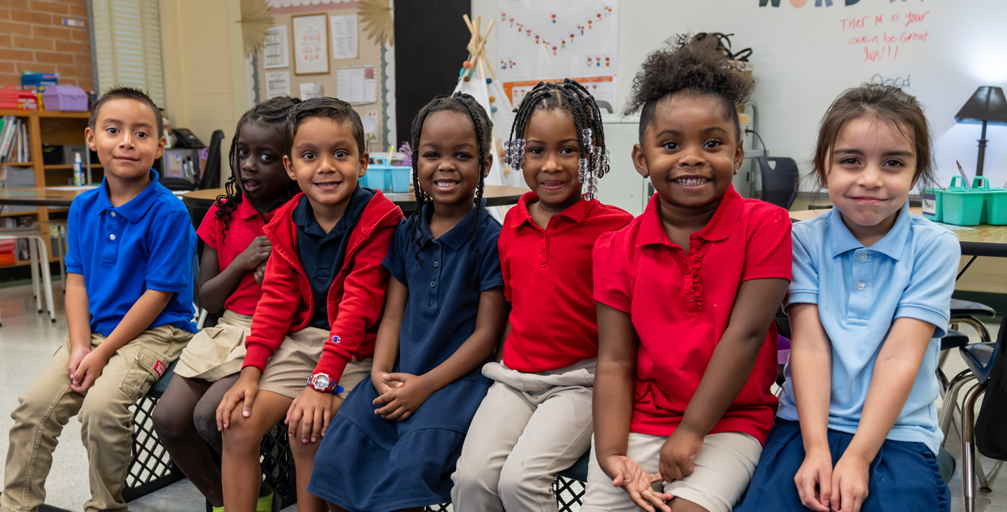 kids sitting together to take a picture