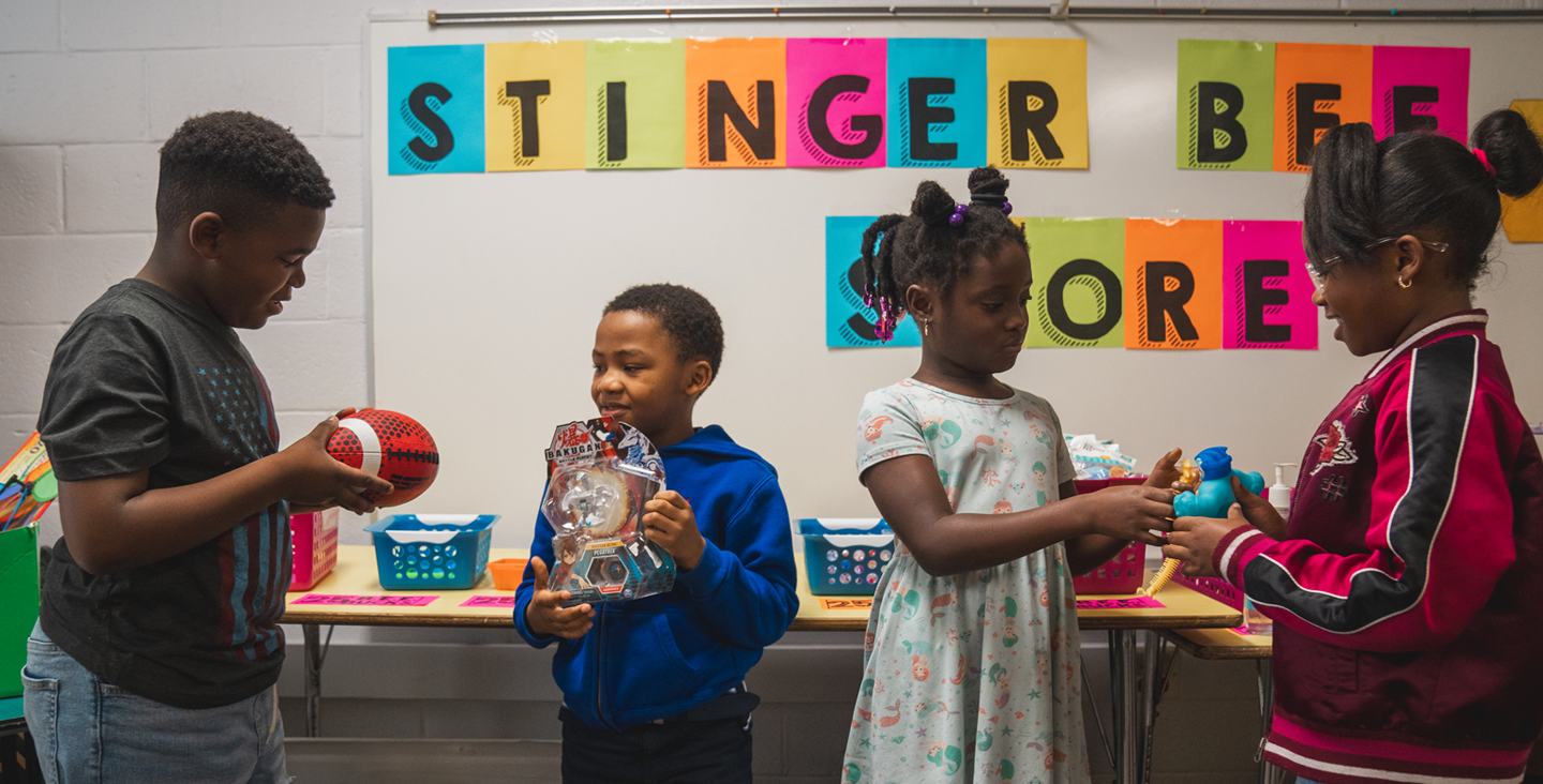 group of students sharing toys