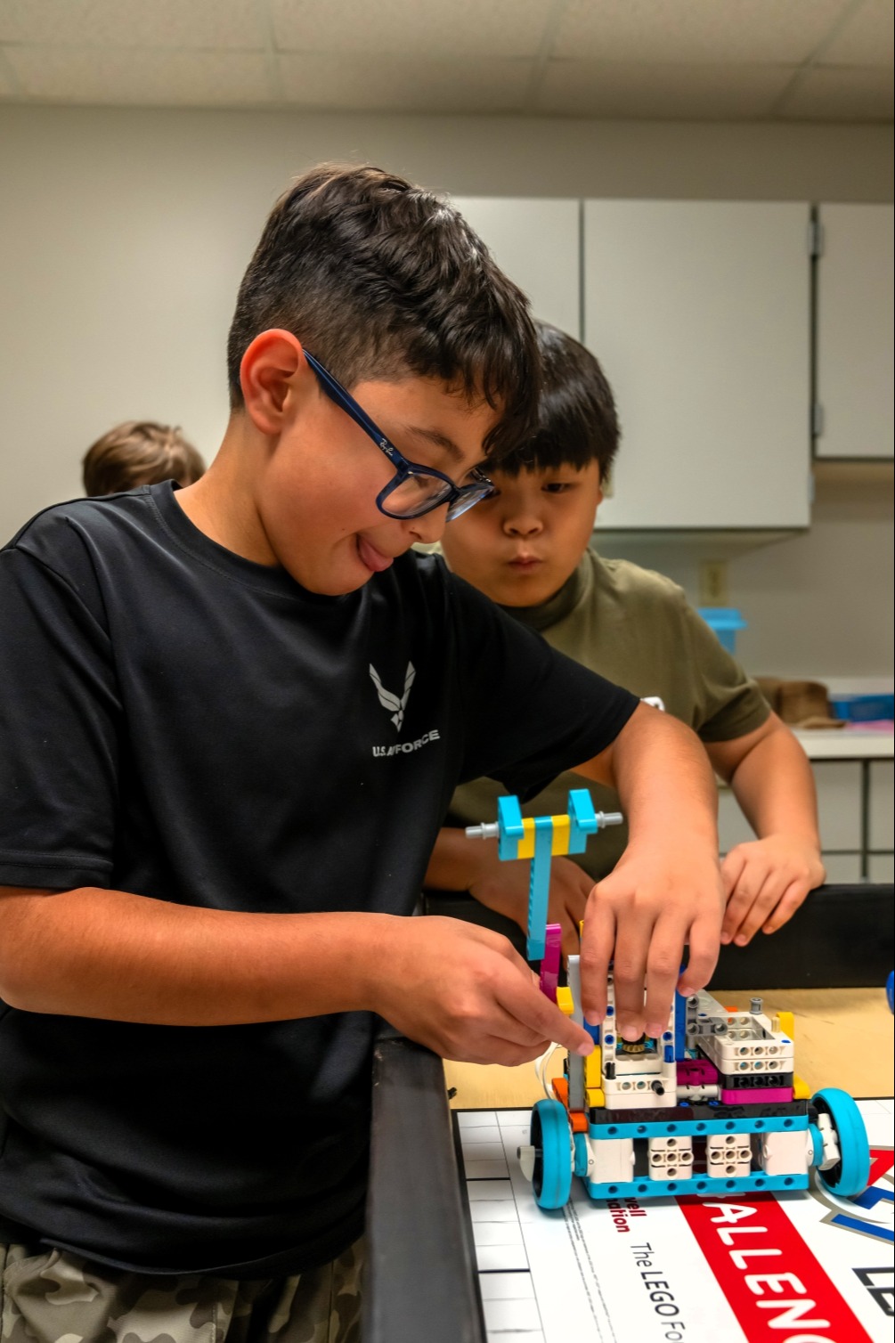 Students building a LEGO robot