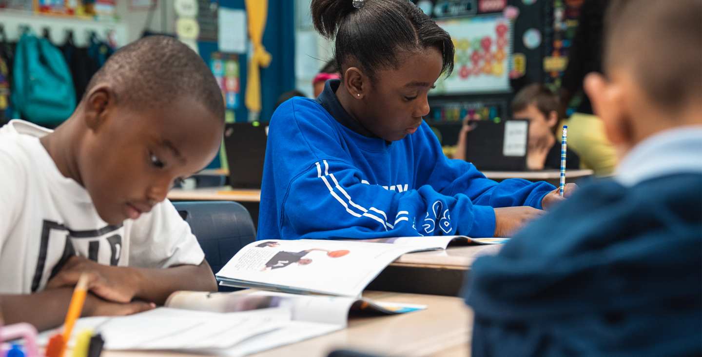 students reading at desks